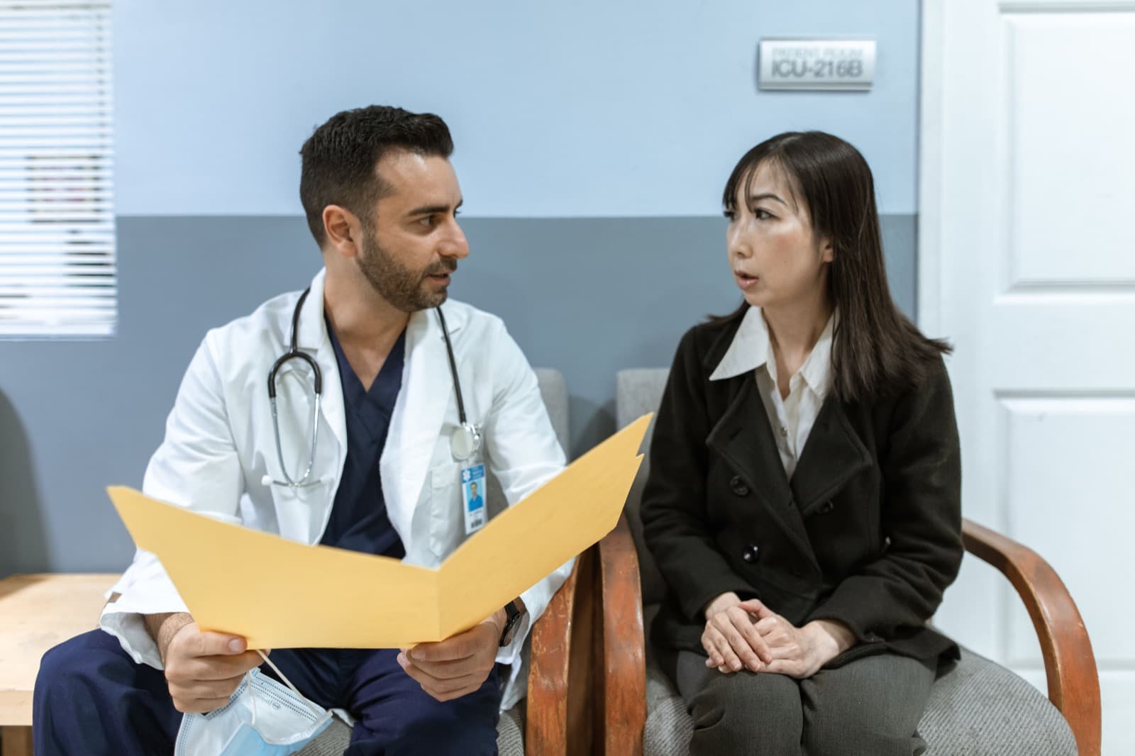 A clinician reviewing a claim folder with a patient